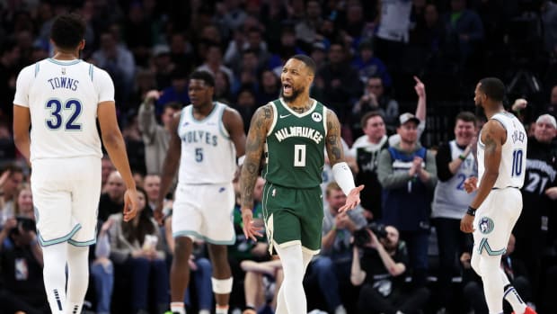 Feb 23, 2024; Minneapolis, Minnesota, USA; Milwaukee Bucks guard Damian Lillard (0) reacts during the first half against the Minnesota Timberwolves at Target Center.